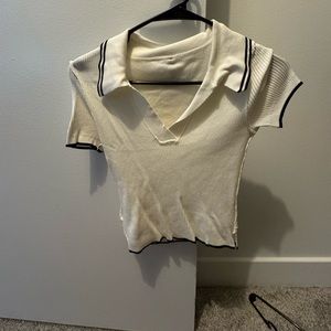 Knit golf style polo with black piping